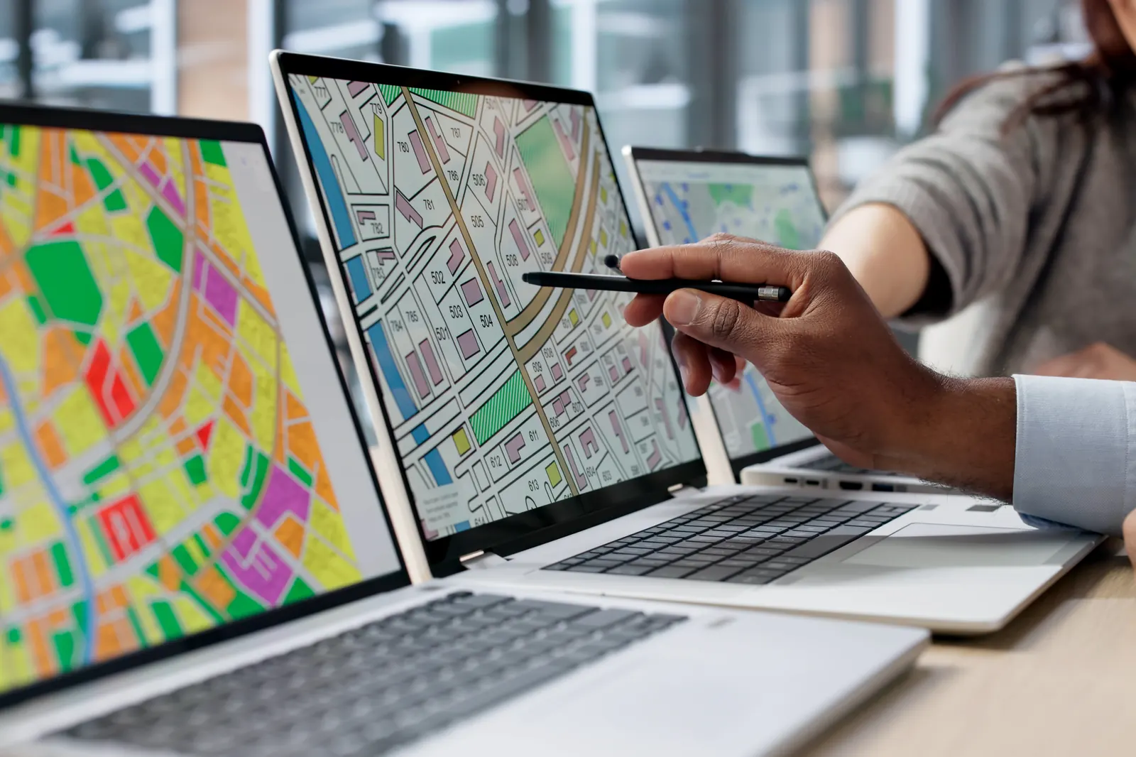 Planning maps displayed on laptop screens